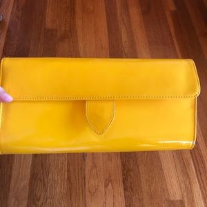 Yellow patent leather clutch
